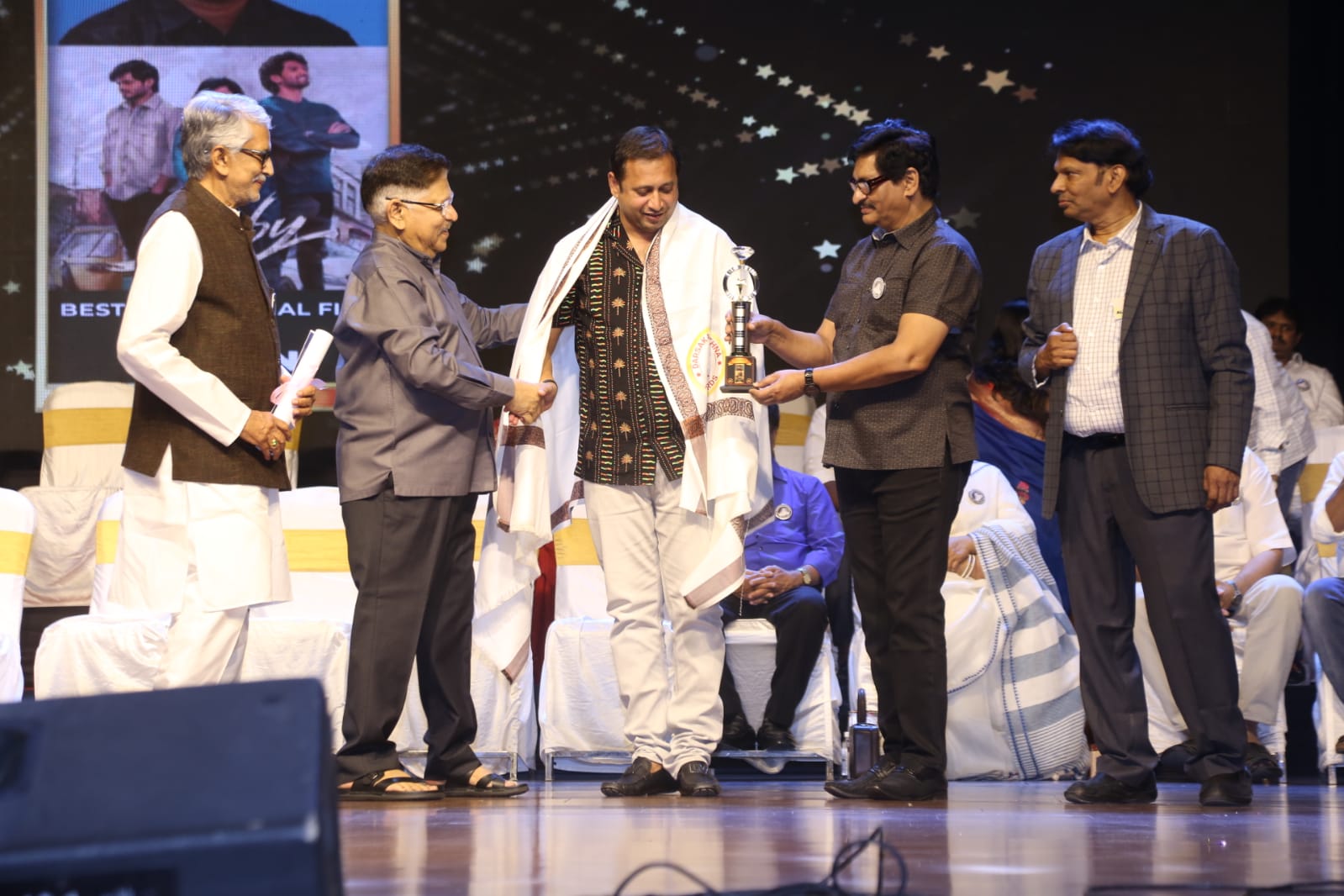 Baby SKN receives the Dasari Film Award from Allu Aravind
